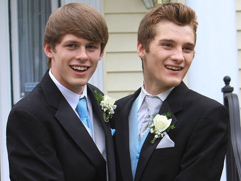 Dylan Meehan and Brad Taylor pose for photos prior to attending their senior prom Monday, June 3, 2013, in Patterson, N.Y.