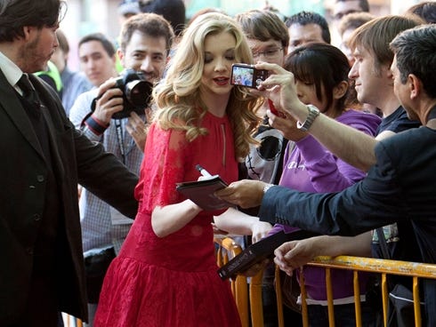British actress Natalie Dormer poses with fans in Madrid on Tuesday.