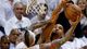 Game 1 in Miami: Spurs 92, Heat 88 --San Antonio Spurs power forward Tim Duncan blocks the shot of Miami Heat power forward Chris Andersen.