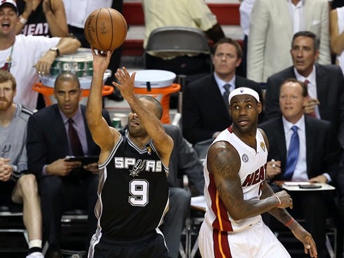 Spurs guard Tony Parker makes a key buzzer-beating jumper in front of Heat forward LeBron James in Game 1 of the NBA Finals.