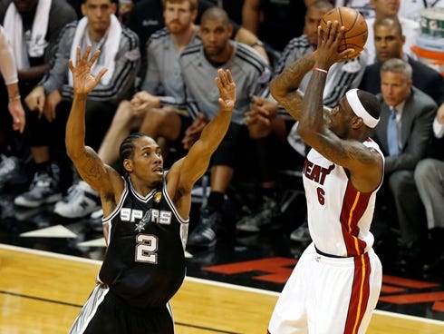 Heat forward LeBron James was forced into long shot attempts by Spurs defender Kawhi Leonard in Game 1 of the NBA Finals on Thursday.