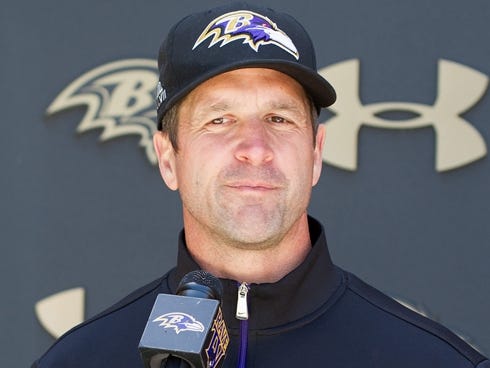 Ravens coach John Harbaugh talks to the press during rookie camp.