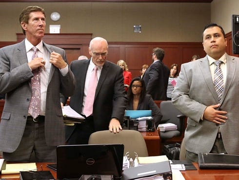 George Zimmerman stands with his defense attorneys Mark O'Mara, left, and Don West at Seminole circuit court, in Sanford, Fla., for a pre-trial hearing Friday, June 7, 2013.