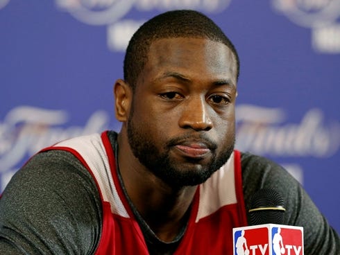 Wade addresses the media prior to practice at the American Airlines Arena.
