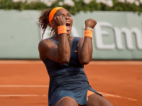 Serena Williams of the USA celebrates after defeating Maria Sharapova of Russia 6-4, 6-4 to win the French Open.