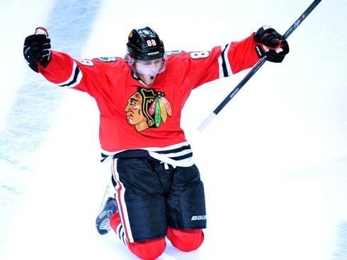 Chicago Blackhawks right wing Patrick Kane leaps in the air after scoring in the second overtime.