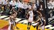 Game 2 in Miami: Heat 103, Spurs 84 - Miami Heat center Chris Bosh (1) defends against San Antonio Spurs power forward Tim Duncan (21).
