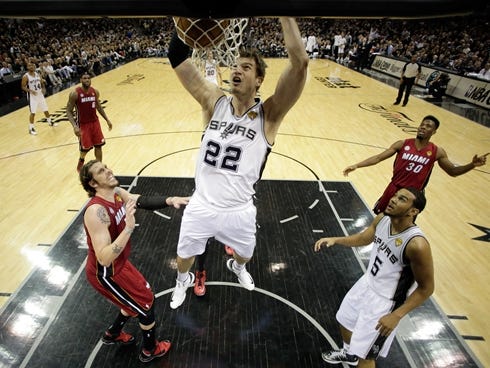 SAN ANTONIO, TX - JUNE 11:  Tiago Splitter #22 of the San Antonio Spurs dunks the ball in the second half against the Miami Heat during Game Three of the 2013 NBA Finals at the AT,T Center on June 11, 2013 in San Antonio, Texas. NOTE TO USER: User ex