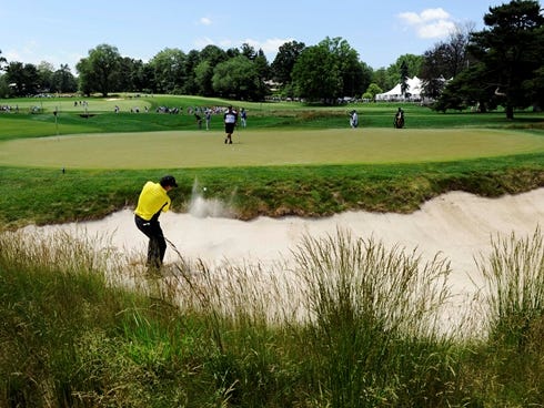 Michael Campbell, the 2005 U.S. Open champion, plays out of a greenside bunker on the fourth the hole during a practice round.