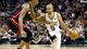 Game 4 in San Antonio: San Antonio Spurs point guard Tony Parker dribbles against Miami Heat center Chris Bosh during the first quarter.
