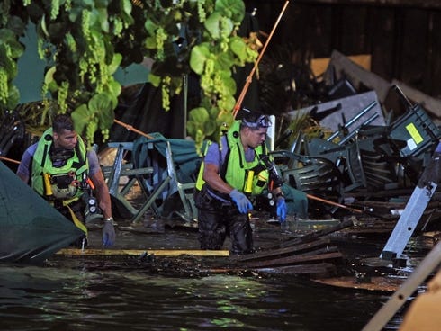 Rescue divers search for missing persons after a packed outdoor deck collapsed at popular Miami-area sports bar Shucker's Bar , Grill Thursday.