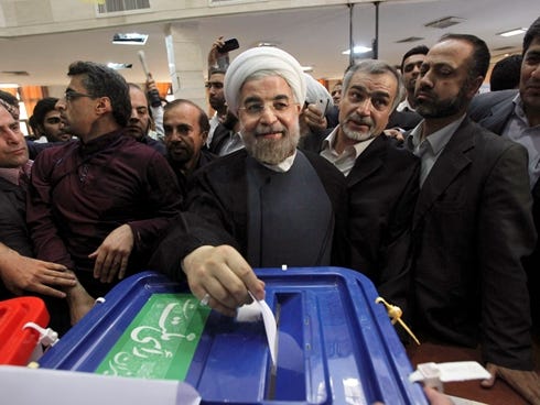 Hasan Rowhani casts his ballot in the presidential election at a polling station in Tehran, Iran, on Friday.