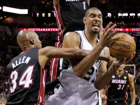 Spurs center Tim Duncan gets fouled by Heat guard Ray Allen in Game 4 of the NBA Finals.