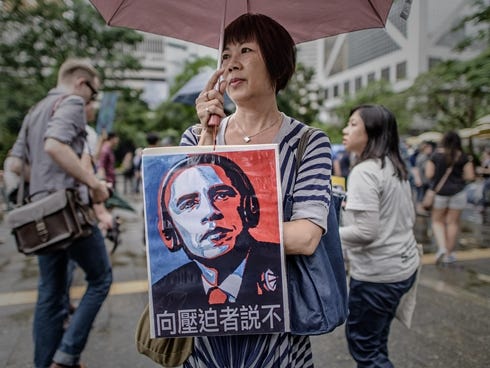 A woman holds a placard during a protest march to the U.S. consulate in support of Edward Snowden on Saturday in Hong Kong.