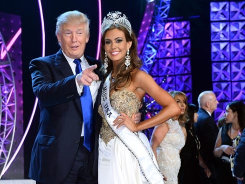 Donald Trump, left, and Miss Connecticut USA Erin Brady pose onstage after Brady won the 2013 Miss USA pageant.