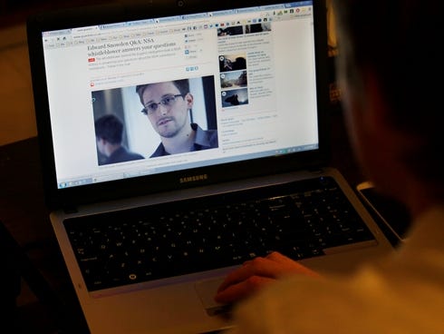 Tom Grundy, an activist, blogger and co-organizer supporting Edward Snowden's campaign, browses the live chat with Snowden on the 'Guardian' website in his house in Hong Kong on Monday.