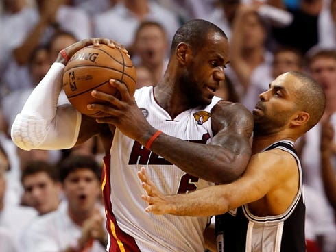 Heat forward LeBron James faces up against Spurs guard Tony Parker in Game 6 of the NBA Finals, which Miami won 103-100.
