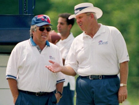 Patriots owner Robert Kraft and coach Bill Parcells converse during the team's 1995 training camp, a year before New England won the AFC.