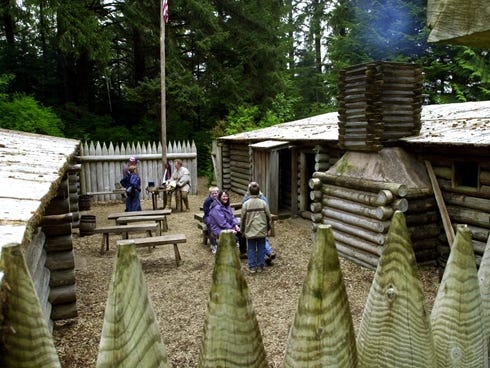Visitors take a break inside the 1806 Fort Clatsop replica near Astoria, Ore. The Corps of Discovery camped at the original fort in the winter of 1805-06.