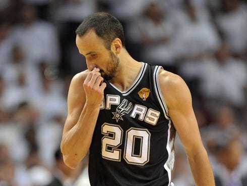 Spurs guard Manu Ginobili wipes his face during Game 7 of the NBA Finals vs. the Heat.