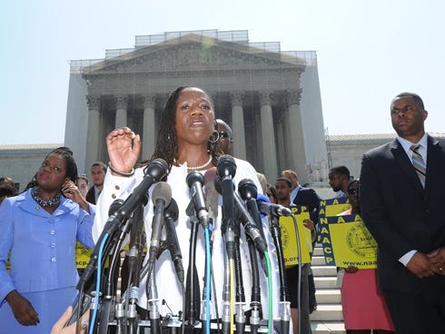 Sherrilyn Ifill, president and director-counsel of the NAACP Legal Defense and Education Fund, reacts to the Supreme Court ruling striking down a key piece of the Voting Rights Act, June 25, 2013, in Washington, D.C.
