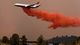Tanker 910 makes a retardant drop on the Yarnell Hill Fire to help protect the Double Bar A Ranch near Peeples Valley on June 30.