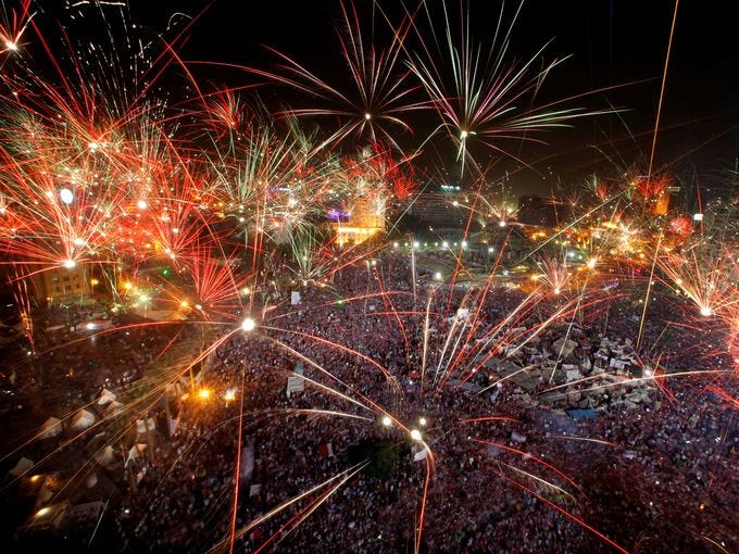 Fireworks light up the sky as opponents of Egypt's ousted president, Mohammed Morsi, celebrate in Tahrir Square on July 3 in Cairo.
