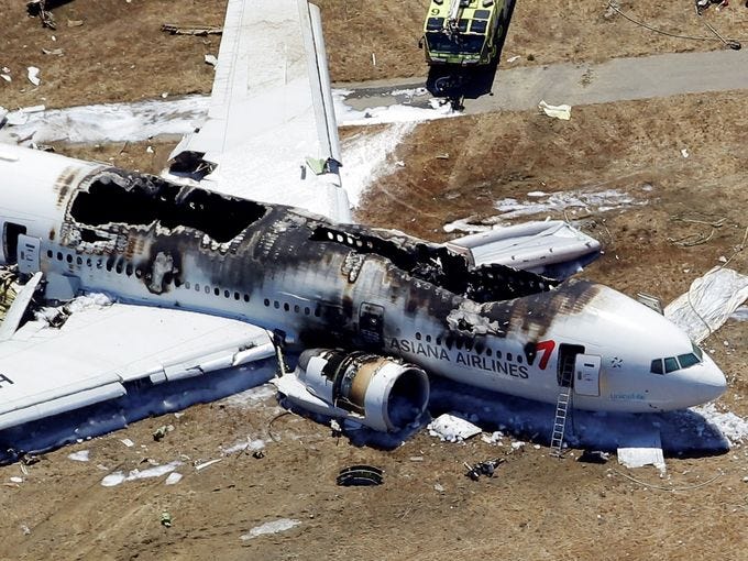 A Boeing 777 airplane lies burned on the runway after it crash landed at San Francisco International Airport July 6, 2013 in San Francisco.