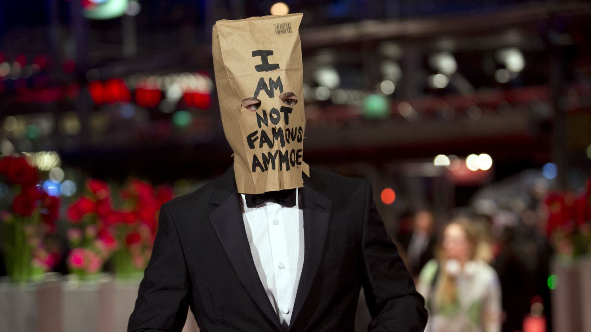 Shia LaBeouf sports paper bag on head at film premiere