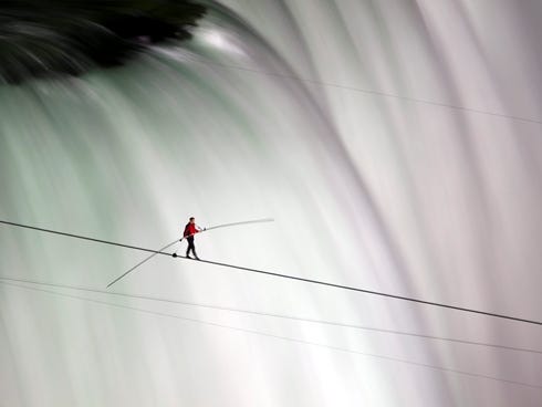 Nik Wallenda walks over Niagara Falls on a tightrope in Niagara Falls, Ontario, on Friday, June 15, 2012. This Sunday, he'll attempt to walk across a 1,500-foot-high river gorge near Grand Canyon National Park.