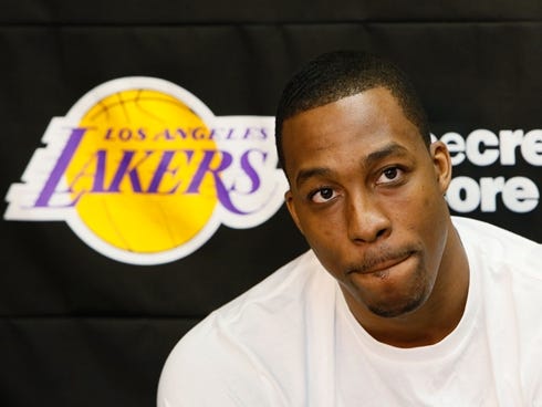 Los Angeles Lakers center Dwight Howard talks to reporters in El Segundo, Calif., Tuesday, April 30, 2013. The Lakes lost their first-round NBA basketball playoff series to the San Antonio Spurs. (AP Photo/Damian Dovarganes) ORG XMIT: CADD111