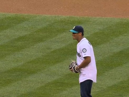 Seattle Seahawks quarterback Russell Wilson throws out the first pitch at the Yankees-Mariners game.