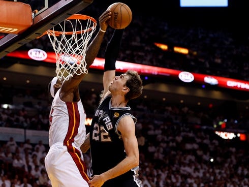Jun 9, 2013; Miami, FL, USA;  Miami Heat small forward LeBron James (6) blocks the shot of San Antonio Spurs center Tiago Splitter (22) during the fourth quarter of game two of the 2013 NBA Finals at the American Airlines Arena. Mandatory Credit: Der