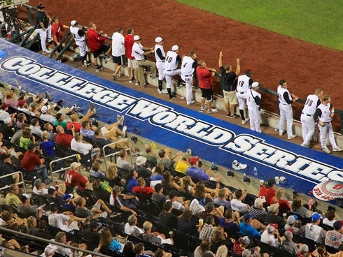 The roof of the Louisville third base dugout has the College World Series sign misspelled during an NCAA College World Series game against Indiana in Omaha, Neb.