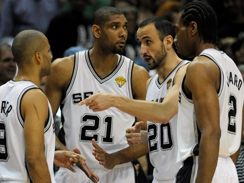Jun 16, 2013; San Antonio, TX, USA; San Antonio Spurs shooting guard Manu Ginobili (20) talks to Tony Parker (9) as Tim Duncan (21) and Kawhi Leonard (2) listen in against the Miami Heat during the first quarter of game five in the 2013 NBA Finals at