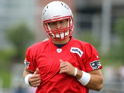 New England Patriots quarterback Tim Tebow runs at the practice field during Minicamp at Gillette Stadium.