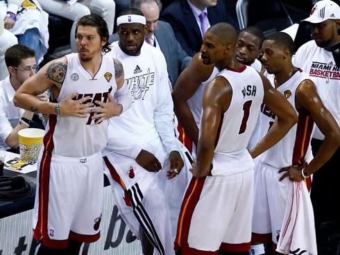 Miami Heat shooting guard Mike Miller (13), LeBron James, Chris Bosh (1), Mario Chalmers (15) and Dwyane Wade (3) react against the San Antonio Spurs during the second quarter of game six in the 2013 NBA Finals at American Airlines Arena.
