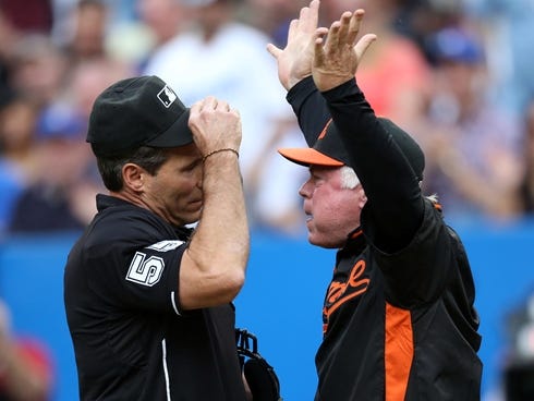 Baltimore Orioles manager Buck Showalter argues with home plate umpire Angel Hernandez against the Toronto Blue Jays at Rogers Centre before being ejected.
