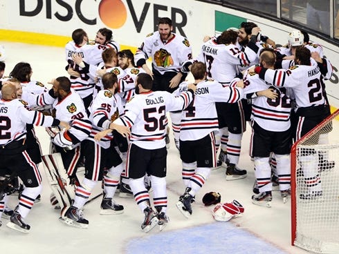 Jun 24, 2013; Boston, MA, USA; Members of the Chicago Blackhawks celebrate after defeating the Boston Bruins 3-2 in game six of the 2013 Stanley Cup Final at TD Garden. Mandatory Credit: Michael Ivins-USA TODAY Sports ORG XMIT: USATSI-134630 ORIG FIL
