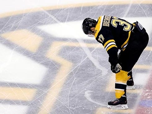 Jun 24, 2013; Boston, MA, USA; Boston Bruins center Patrice Bergeron (37) warms up before game six of the 2013 Stanley Cup Final against the Chicago Blackhawks at TD Garden. Mandatory Credit: Greg M. Cooper-USA TODAY Sports ORG XMIT: USATSI-134630 OR
