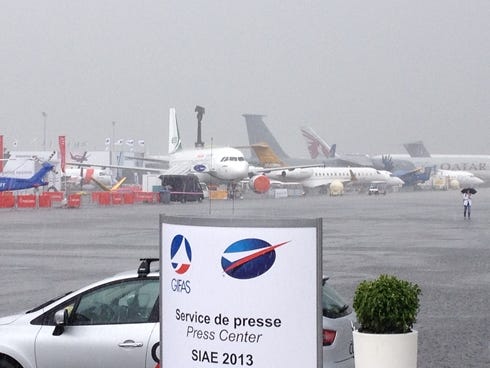 Heavy rain falls during the opening hour of the 2013 Paris Air Show in Le Bourget, France.