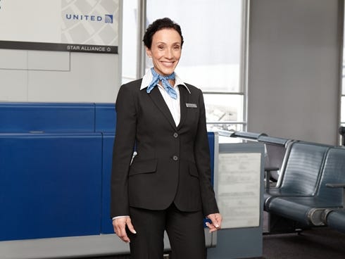 A United Airlines attendant shows off the company's new uniform.