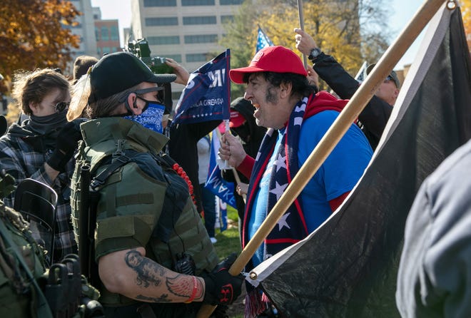 National Guard's no-show at Capitol riots shows lack of preparation - Breaking News A Trump supporter shouts down counter-protesters during a demonstration over election ballot counting outside the Michigan State Capitol building on November 07, 2020 in Lansing, Michigan.