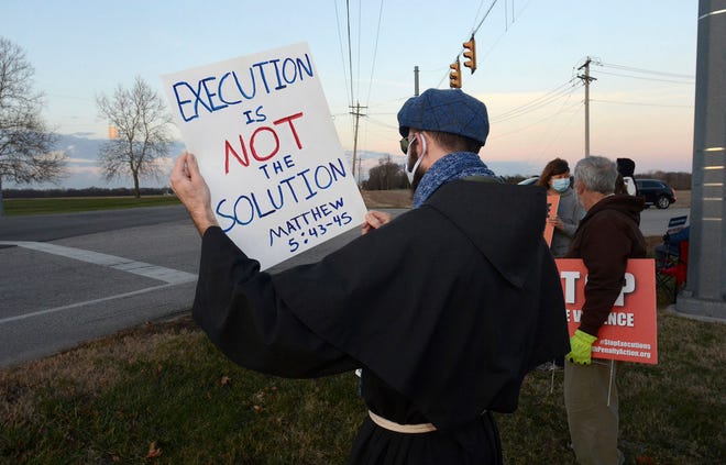 Execution of Black men like Brandon Bernard reflects bias, critics say 4 Brother Ian Bremar, a conventual Franciscan, holds a sign during the protest of the execution of Orlando Hall outside of the Federal Correctional Complex in Terre Haute, Ind., on Thursday, Nov. 19, 2020. A federal judge halted the scheduled execution Thursday of Orlando Hall, a man convicted of kidnapping and raping a 16-year-old Texas girl, bludgeoning her with a shovel and burying her alive.