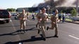 Military personnel flee from the Pentagon after a plane