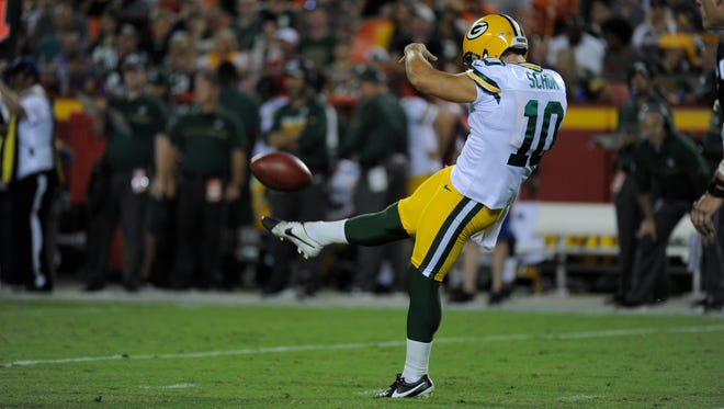Green Bay Packers punter Jacob Schum (10) punts during the second half against the Kansas City Chiefs.