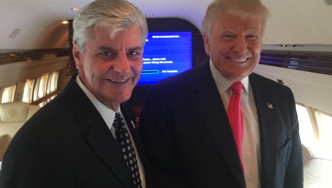 Gov. Phil Bryant, left, an ardent supporter of President-Elect Donald Trump, is expected to have a large say in federal appointments that affect Mississippi.