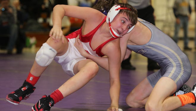 C.J. McMonegal from North Rockland, left, beat Hunter Brown from Warwick in the 99 pound weight class, during wrestling finals at the 52nd annual Murphy-Guccione Shoreline Classic at New Rochelle High School, Jan. 9, 2016. 