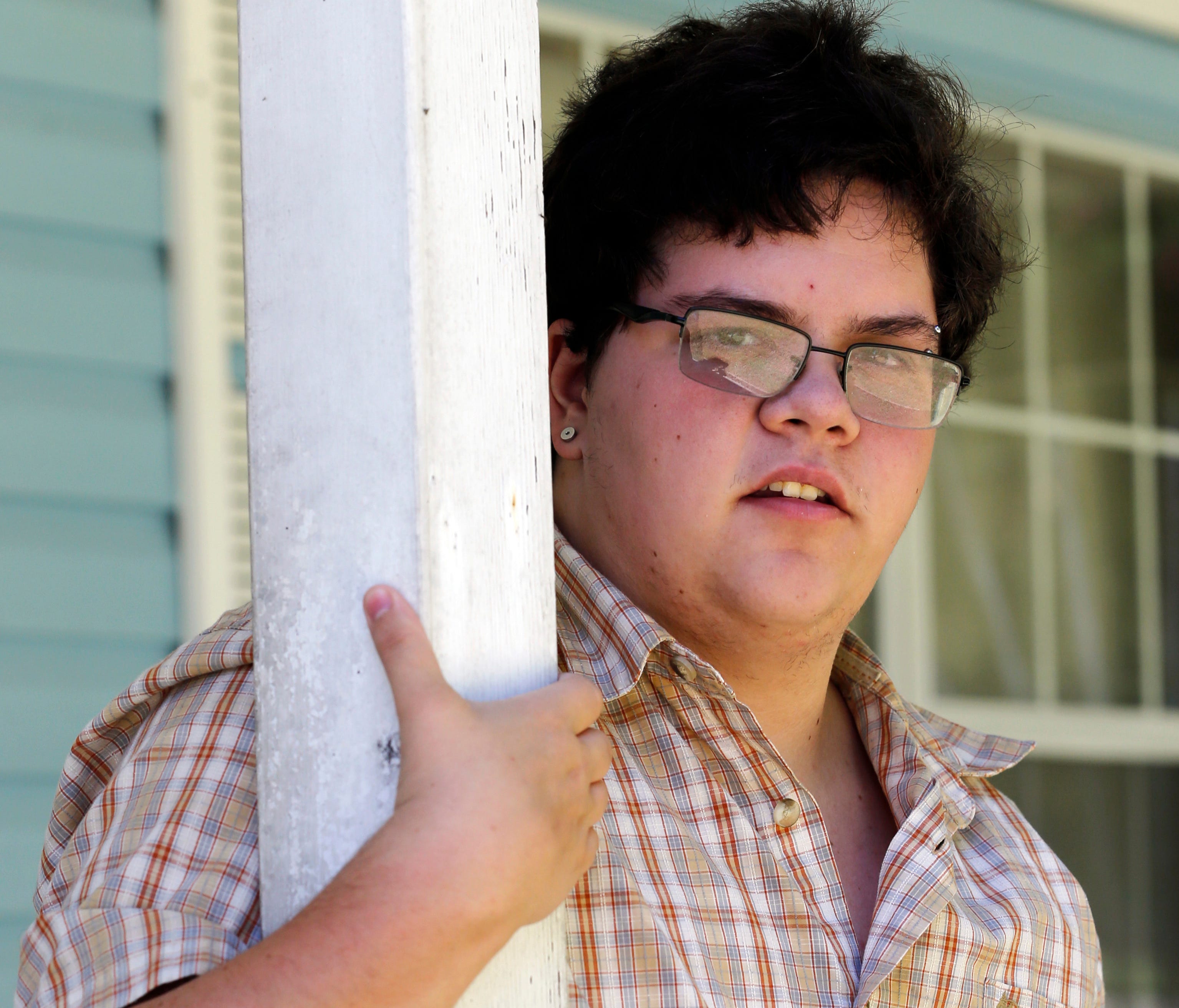In this Monday, Aug. 22, 2016 photo, transgender high school student Gavin Grimm poses in Gloucester, Va. Grimm, who was born female but identifies as male, heads back to Gloucester High School for his senior year as the U.S. Supreme Court considers 