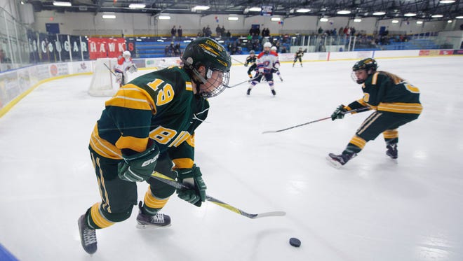 BFA's Meghan Connor (19) plays the puck during the girls high school hockey game between BFA-St. Albans and Mount Mansfield/Champlain Valley Union at the Essex Skating Facility this past weekend.